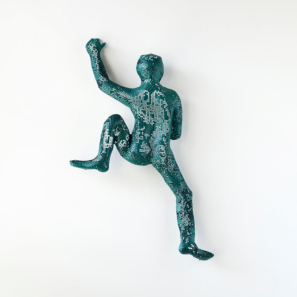 Contemporary metal wall art Climbing man sculpture by nuntchi