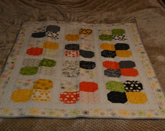 Quilted wall hanging or lap quilt. Machine pieced and quilted in beautiful comma by zen chick fabrics