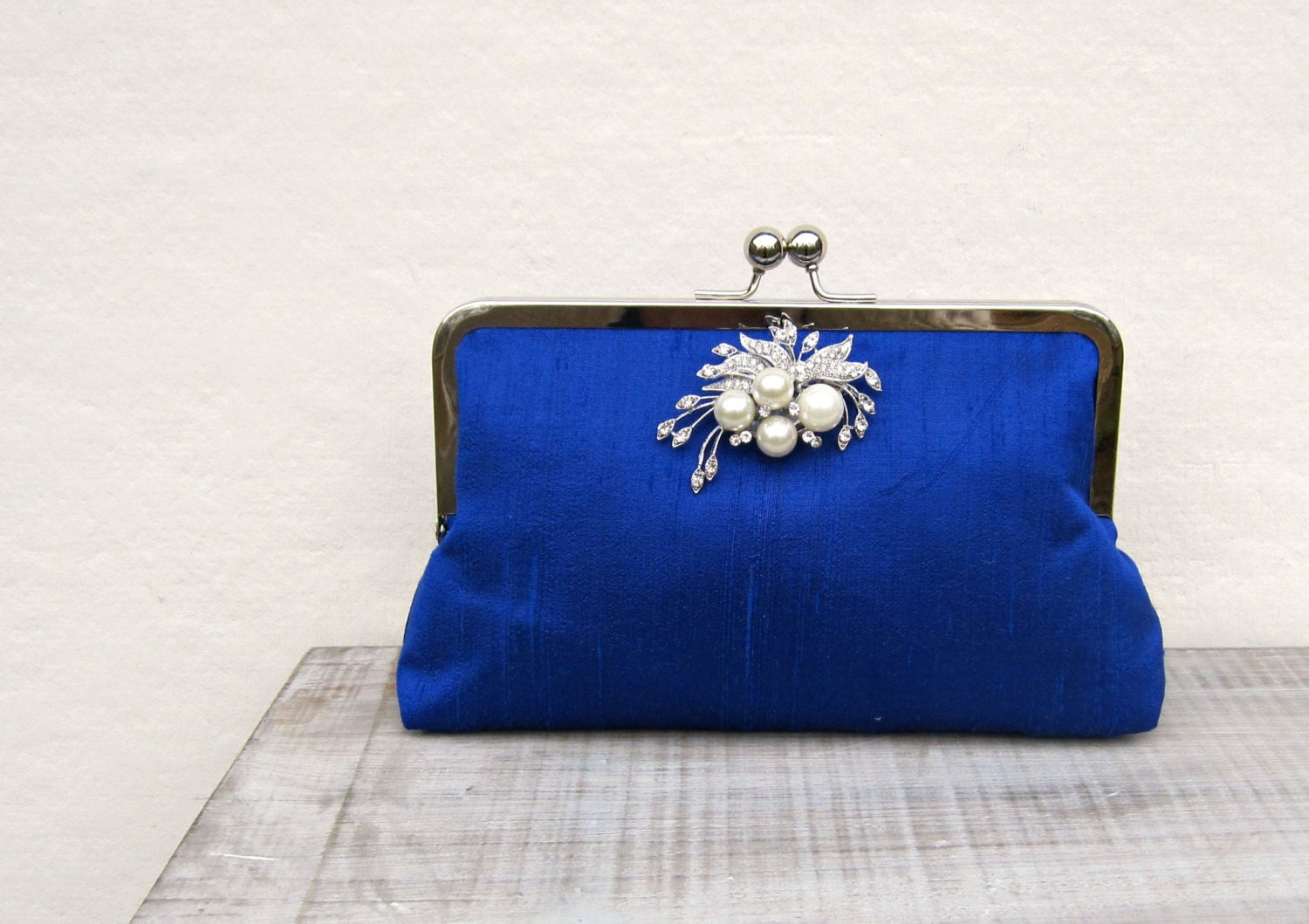 royal blue and silver clutch bag