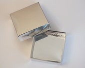 Silver mirror gift box.Square silver gift box.Mirror shine gift box.Paper gift box.Silver carstock gift box.Packaging box.Unmounted gift box