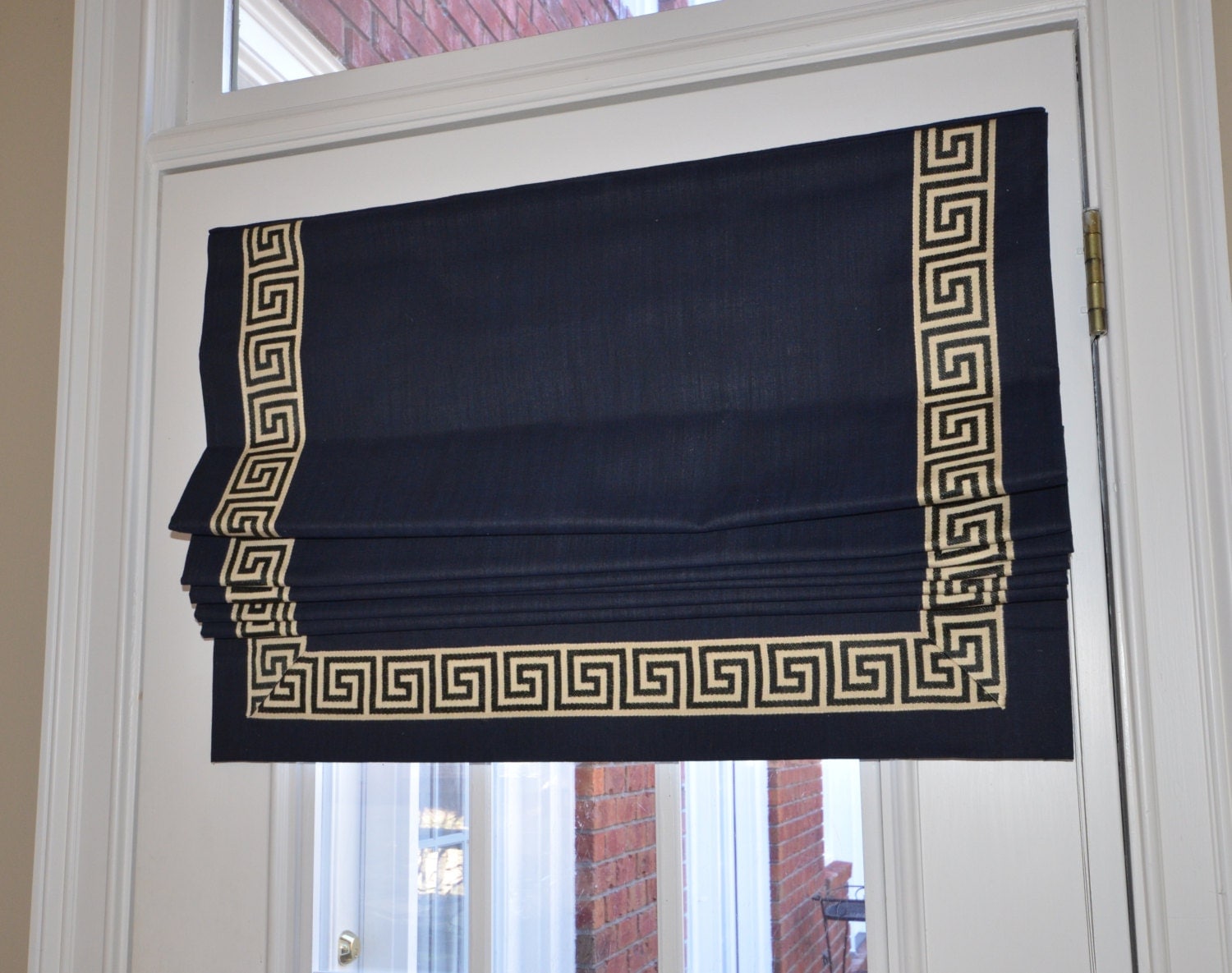 Custom flat banded roman shade with Greek Key Banding