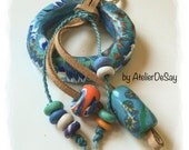 Lovely boho  keychain  or  charm for backpacks . Handmade in polymer clay. Unique turquoise orange  lively colors leather  and metal ring