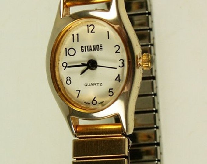 Storewide 25% Off SALE Lovely Vintage Ladies Gitano Designer Quartz Gold Tone White Dial Watch Featuring Twist-A-Flex Adjustable Band