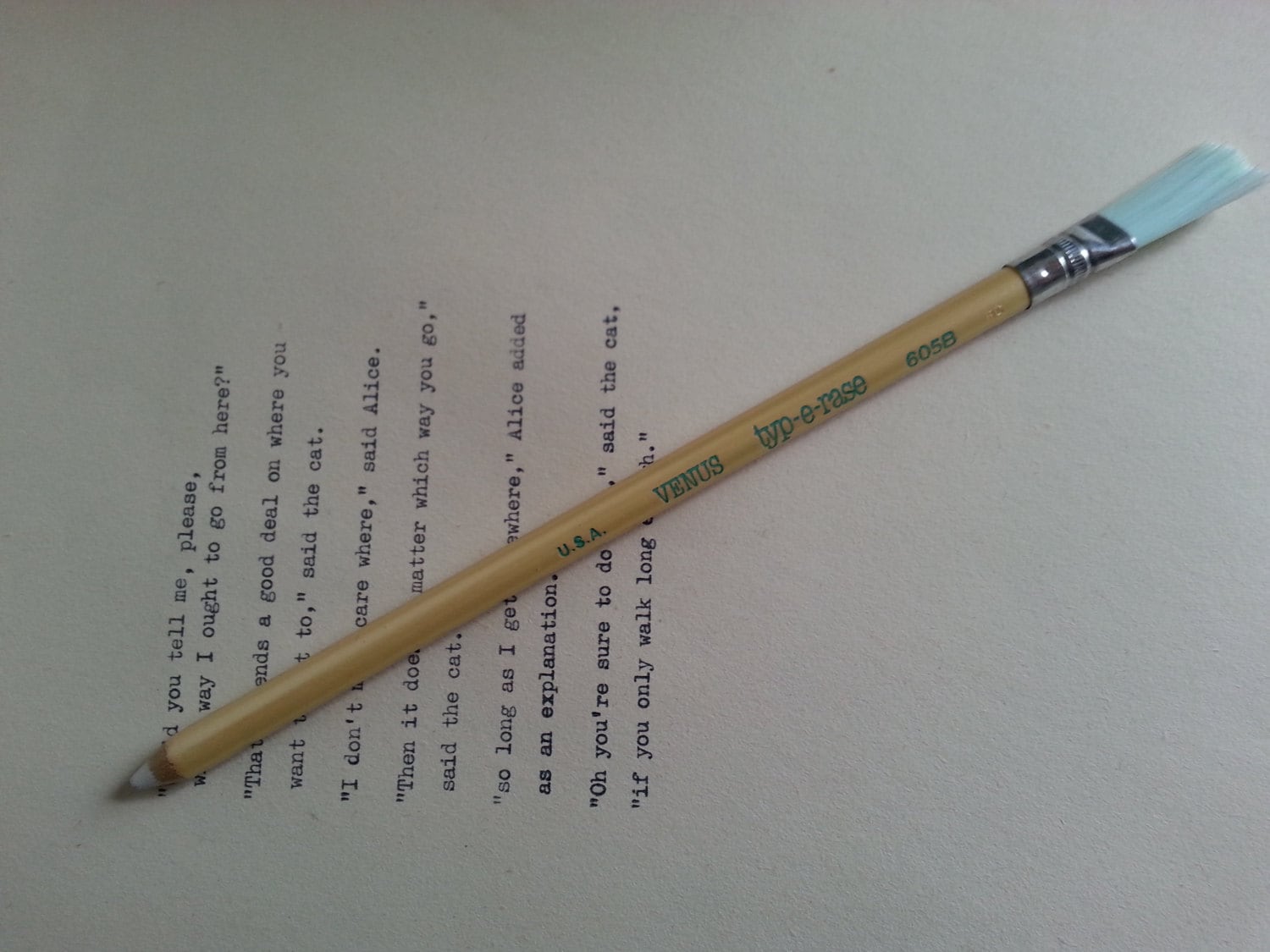 Typewriter eraser pencil shape with brush