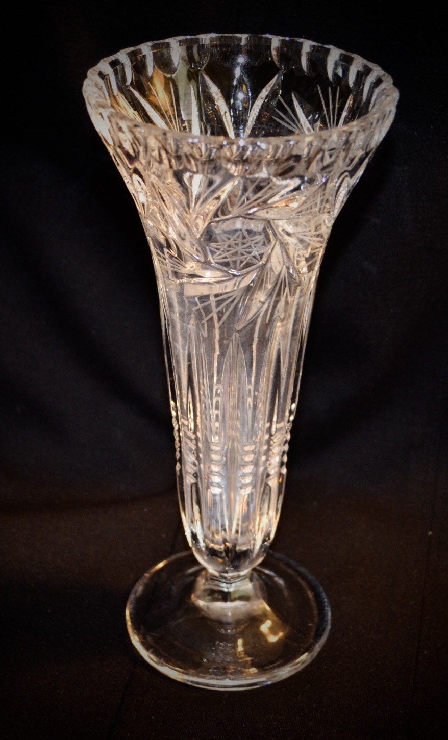 Pinwheel cut glass bud vase.