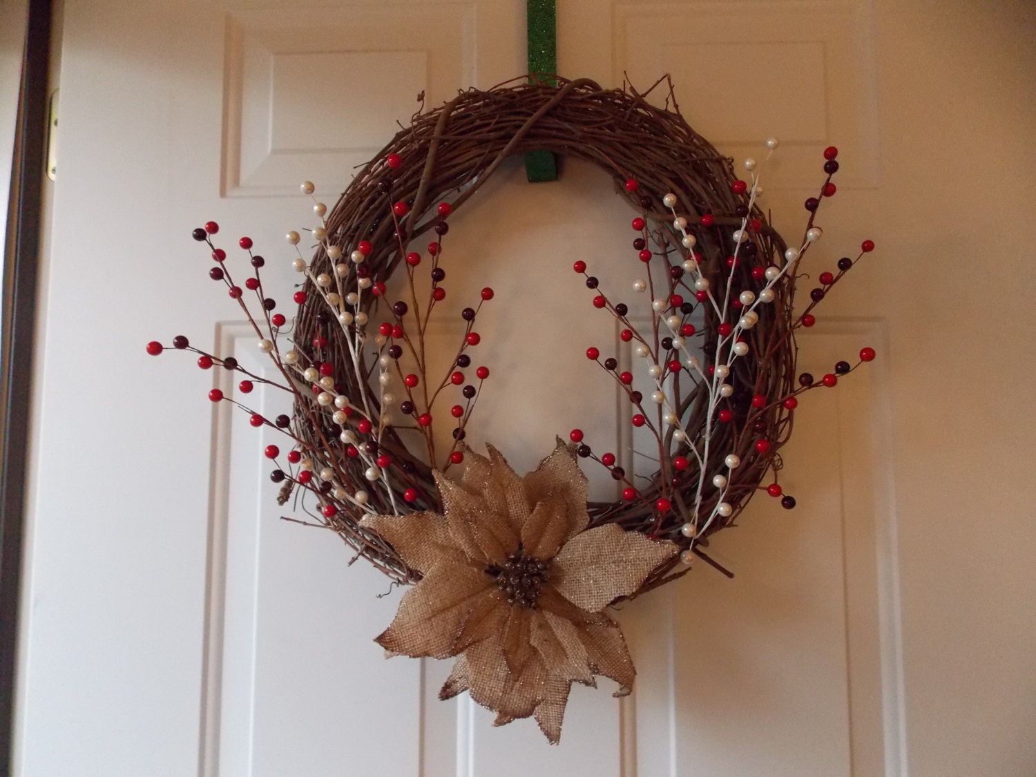 18" Grapevine Wreath with burlap poinsettia and cranberries