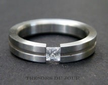 Tension set emerald cut engagement rings
