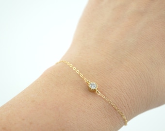 Image result for A dainty gold bracelet.