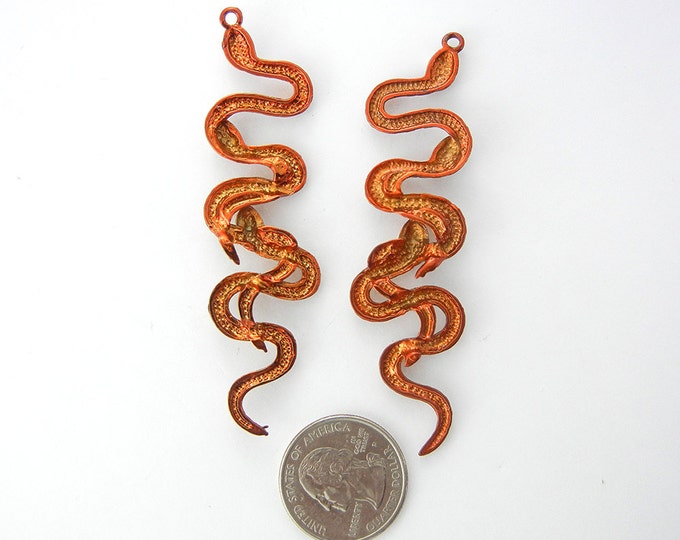 Pair of Long Pearlized Orange Epoxy Triple Snake Charms Rhinestone Eyes