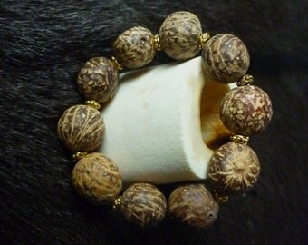 Bracelet graines et métal doré