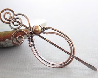 Scarf pin or shawl pin in copper paisley shape with bronze pearl and a pin stick