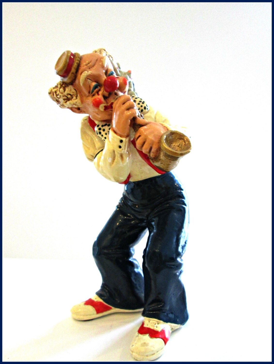 Vintage Clown Figurine Playing A Musical by violetsvintagevault