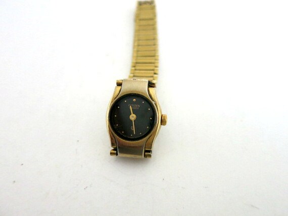 gold citizen watch black face