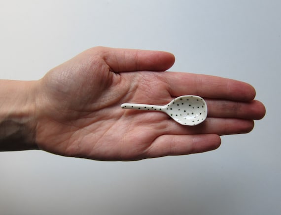 White porcelain spoon with green dots