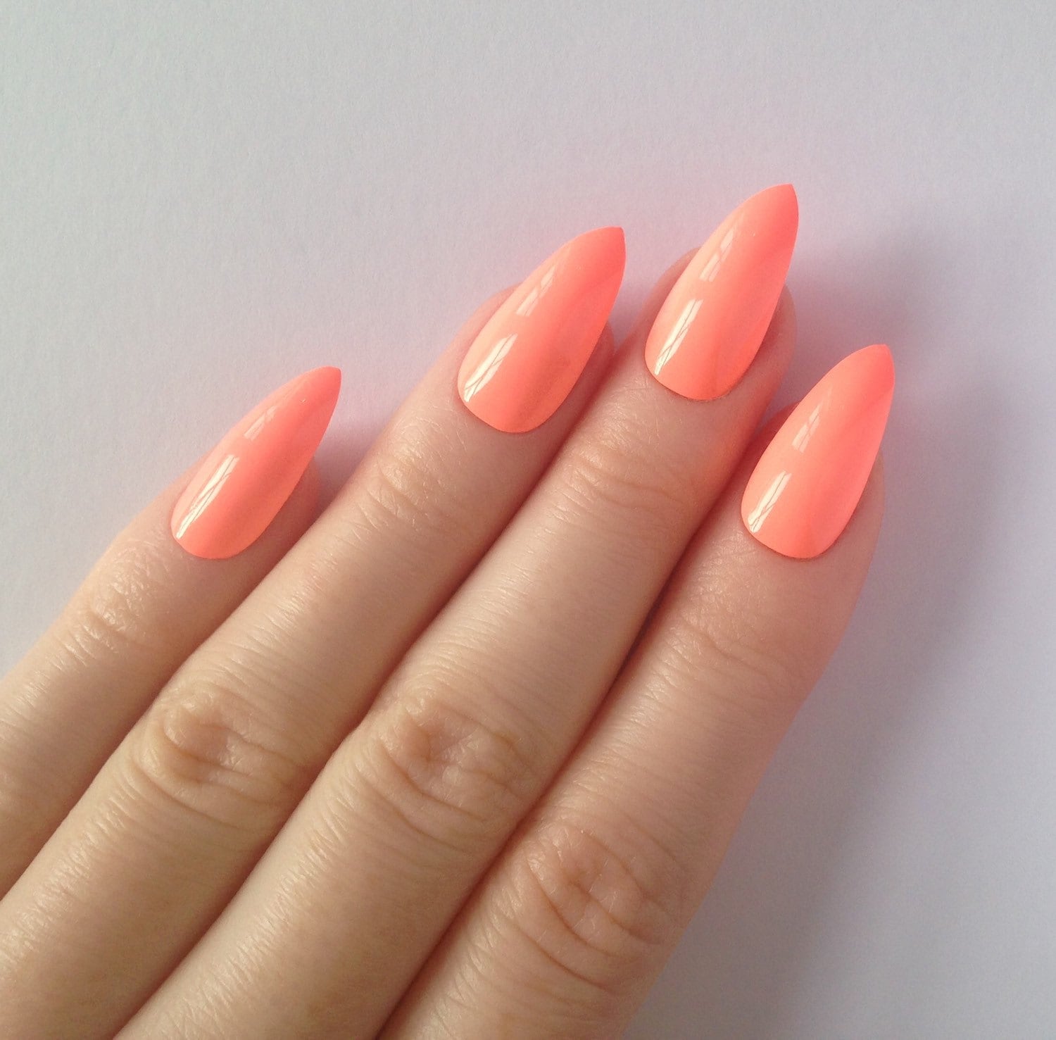 Neon peach stiletto nails Nail designs Nail by prettylittlepolish