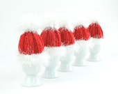 Egg cosies "Santa" in white and red for the breakfast table at Christmas