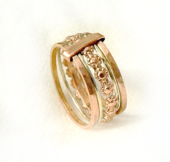 Solid gold stacking rings five rings joined together rose