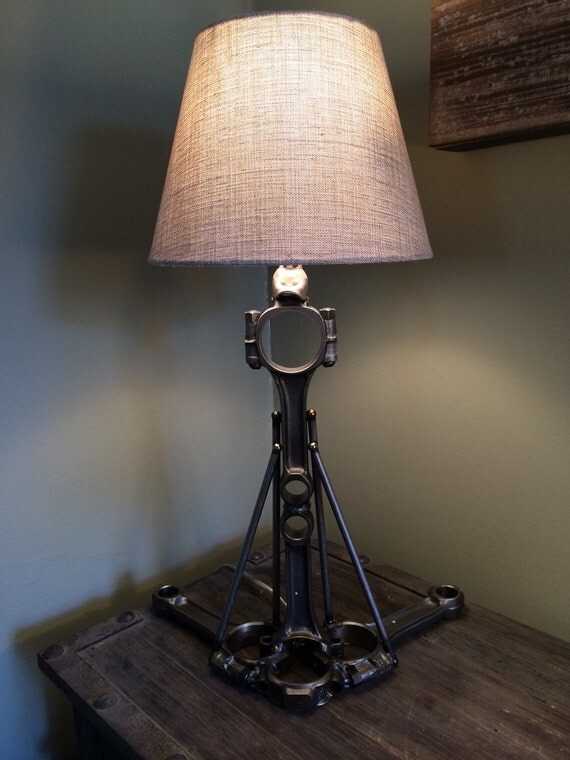 Hand crafted table lamp using repurposed engine/car parts.