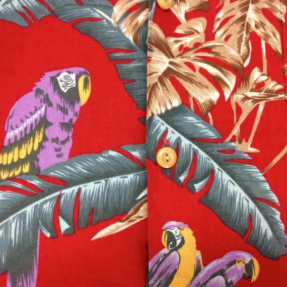 Magnum PI Paradise Found Hawaiian shirt. Red parrot motif.