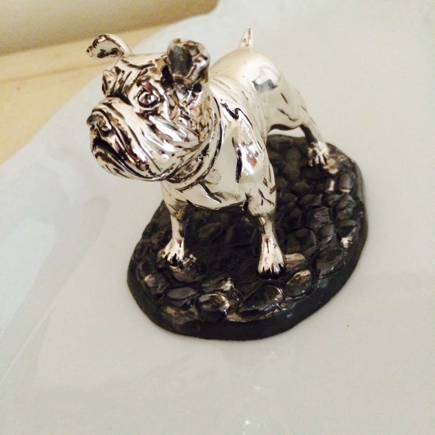 large silver bulldog statue