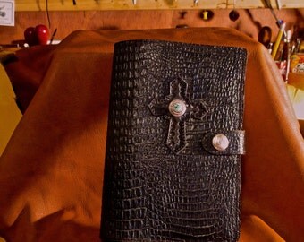 Black Leather Bible Cover size 5" by 8" with embossed croc leather. Bible included.