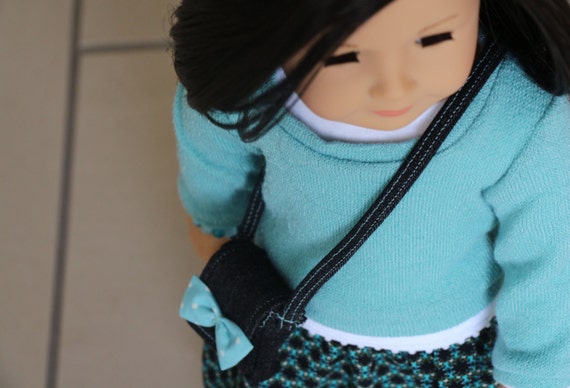 American Girl Doll Clothes fits 18 inch Dolls.  Aqua Sweater, Print Skirt, White T-shirt, Cross Body Bag, Black Tights, and Bracelet