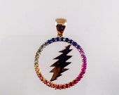 Grateful Dead, 18k Gold Round 13 Point Bolt Pendant with Blue, Purple, Pink, Orange, Yellow, and Green Sapphires