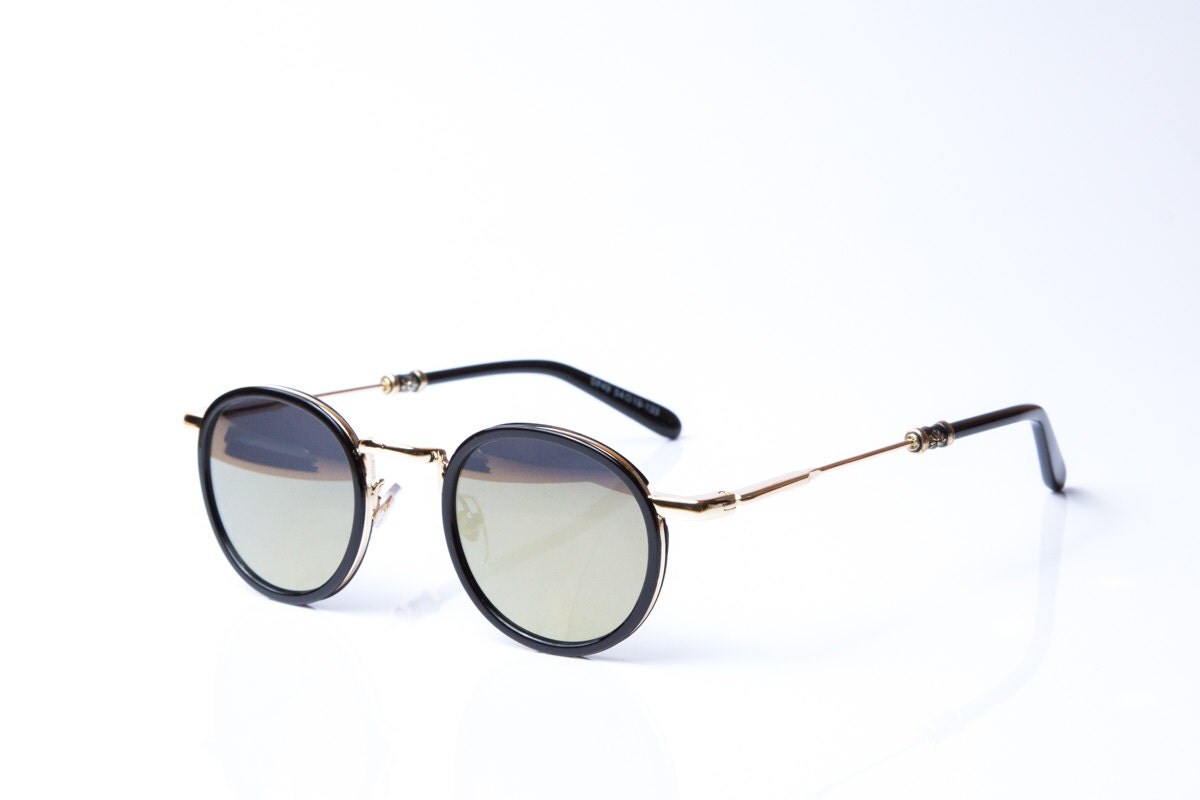 Vintage round with black metal round sunglasses in gold. Mirrored ...