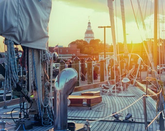 ... photography of the sunset behind the capitol building in annapolis, md