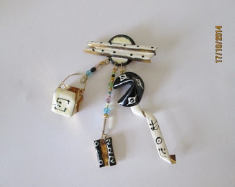 LUNCH at the RITZ (u s) brooch ''Fortune cookies'' 1988.