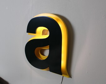 Letter light a green and yellow sign industrial type