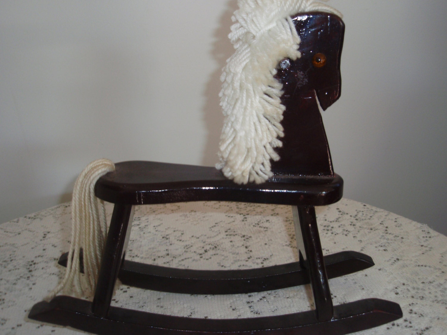 animated demon doll on rocking horse