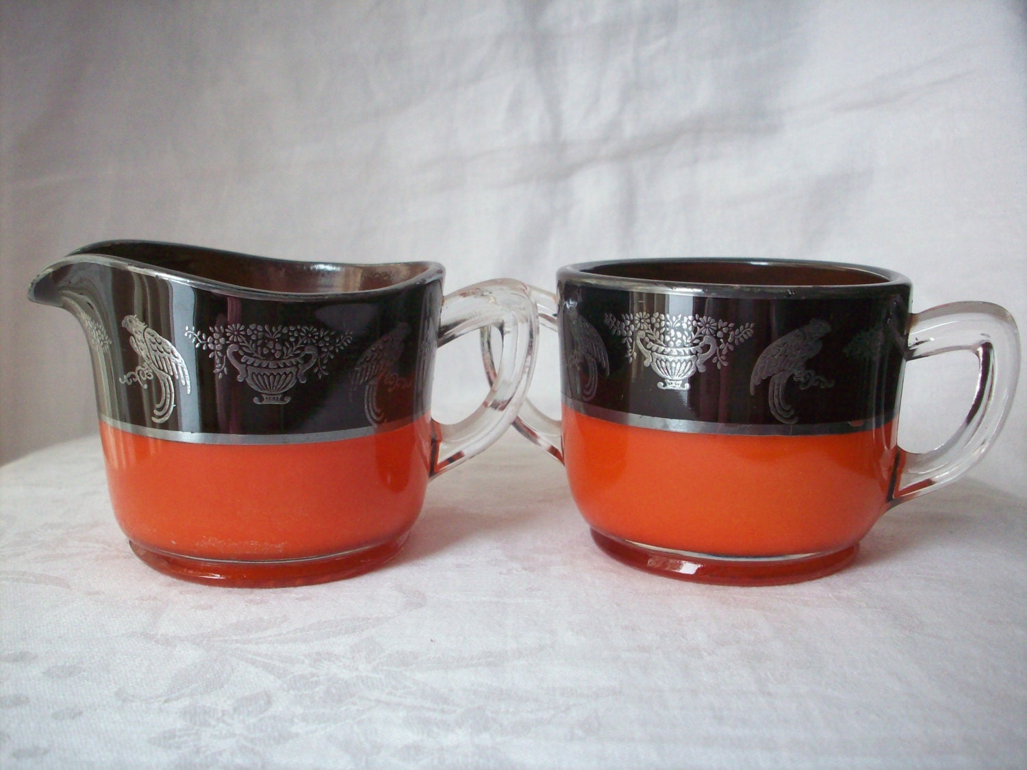 Vintage Orange and Black Cream and Sugar Set with Silver Overlay