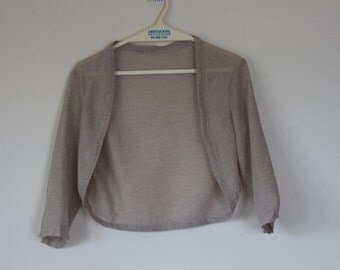 Downloadable sewing pattern for a cardigan/shawl in one piece with sleeves.Size 14.tiled A4
