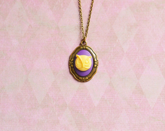The wisdom of owls // Pendant made of metal brass, polymer clay cameo, Yellow owl on a purple background
