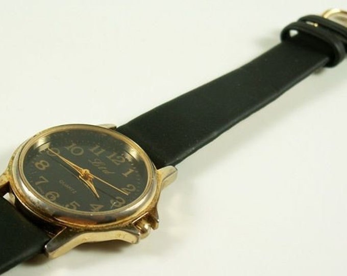 Storewide 25% Off SALE Fantastic Vintage LTD Designer Quartz Gold Tone Trim Black Dial Watch Featring Original All Black Leather Band