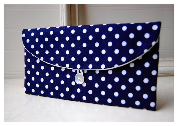 navy and white polka dot clutch bag