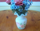 ROSE FLORAL ARRANGEMENT Pink Rose surrounded by blue flowers in vase