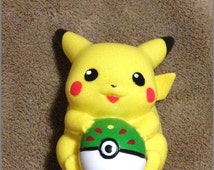 pikachu holding pokeball