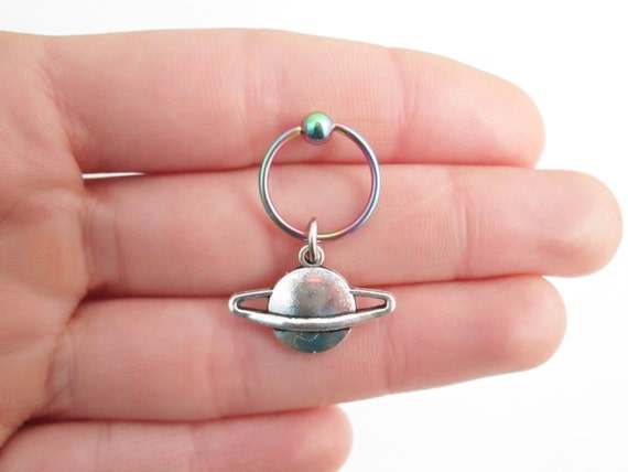 Rainbow planet saturn rook captive ring piercing