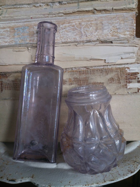 Two Antique Purple Amethyst Bottles ... early 1900s glass ...