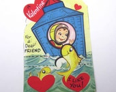 Vintage Unused Children's Novelty Valentine Card with Space Boy in Astronaut Suit Helmet Space Capsule Landing in Water with Yellow Fish
