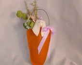 Carrot Top.  This little bunny tucked herself into a little carrot made of felt for a wee nap.