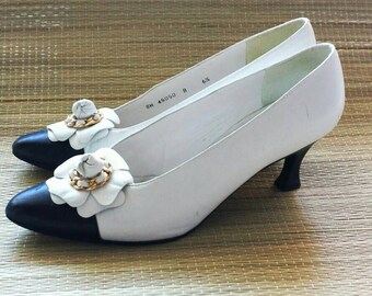 red and white spectator pumps