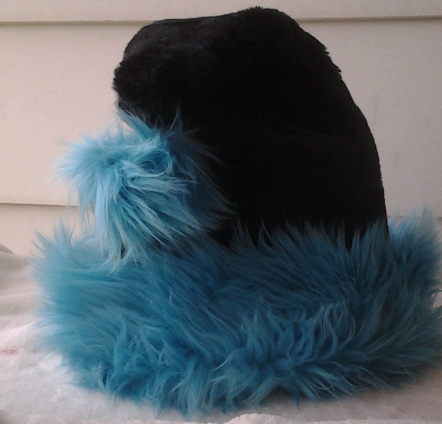 teal shaggy fur trimmed santa hat on black or white hat with teal shaggy fur trimmed santa hat on black or white hat with