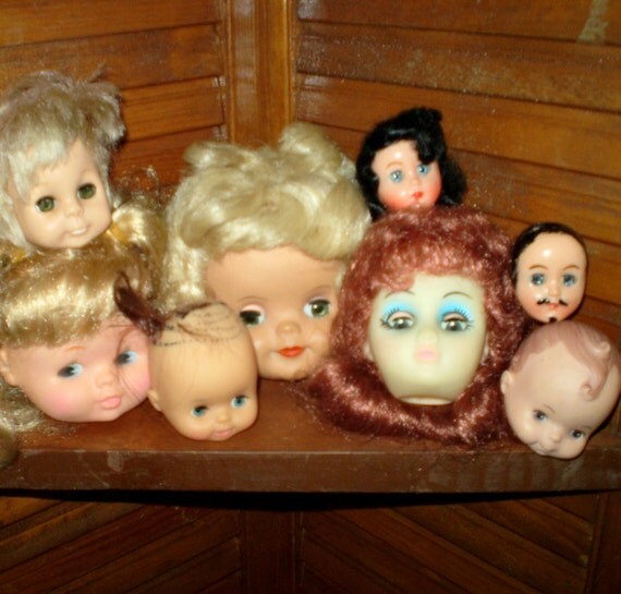 doll heads in jars