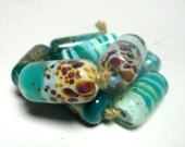 Lampwork. Glass bead handmade. Beads yellow, turquoise, white.