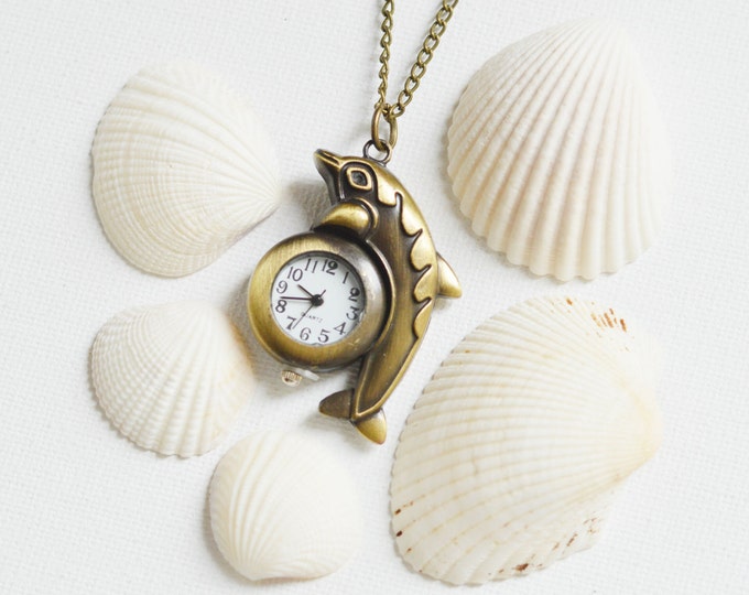SALE! Once in the Ocean Pendant in the shape of a Dolphin with a clock, metal brass, Nautical