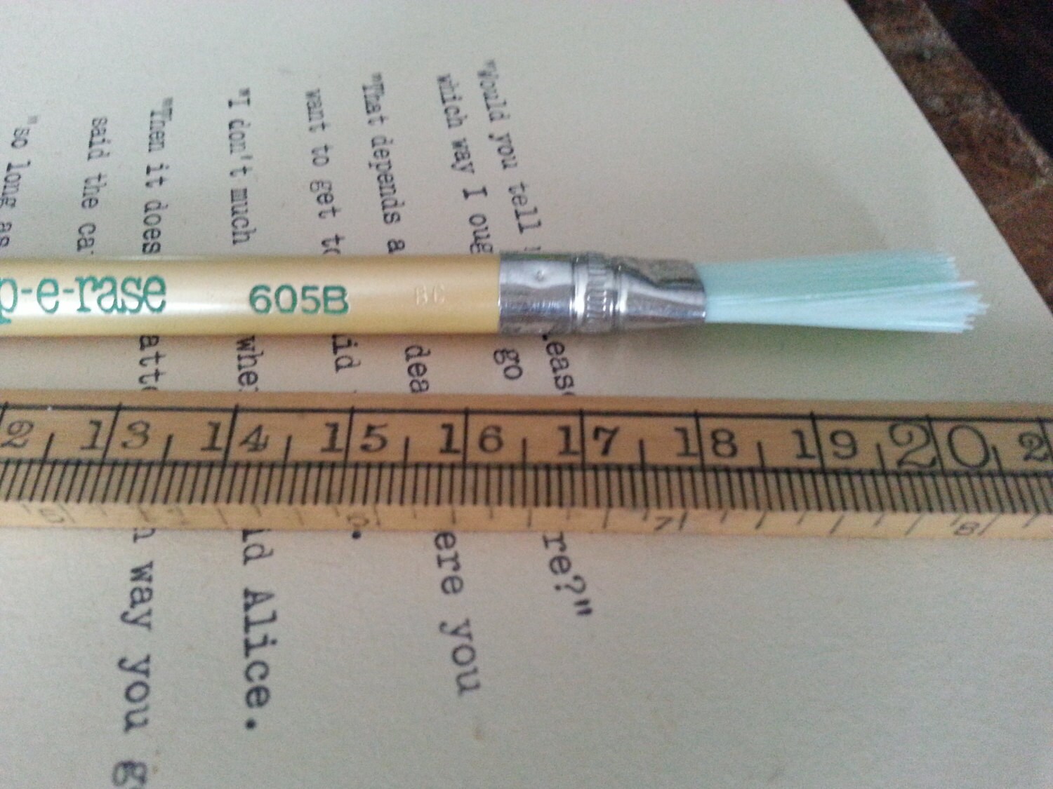 Typewriter eraser pencil shape with brush