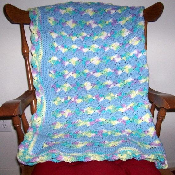 Items similar to Blue and variegated yarn baby blanket. on Etsy